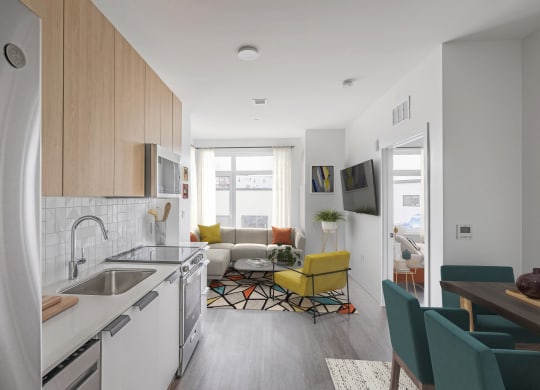 a kitchen and living room in a small apartment