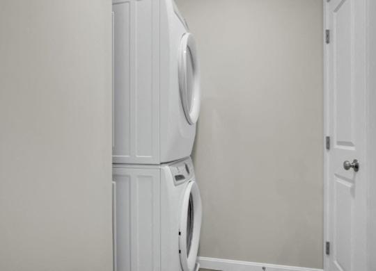 a white washer and dryer in a white room