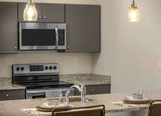 a kitchen with a sink and a microwave