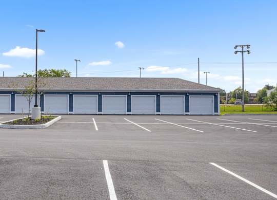 A large building with a parking lot in front of it.