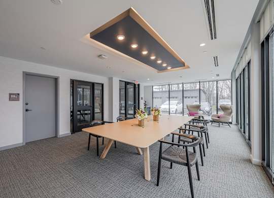 A conference room with a long table and chairs at Seacoast Residences Apartments, Oakland, ME, 03904