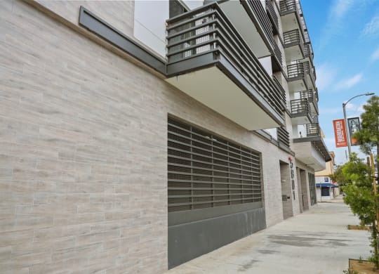 a garage door on the side of an apartment building at The Fairfax Flats Apartments, Los Angeles, CA