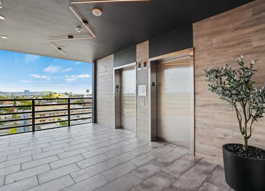 a view of the front doors of a building at The Fairfax Flats Apartments, California