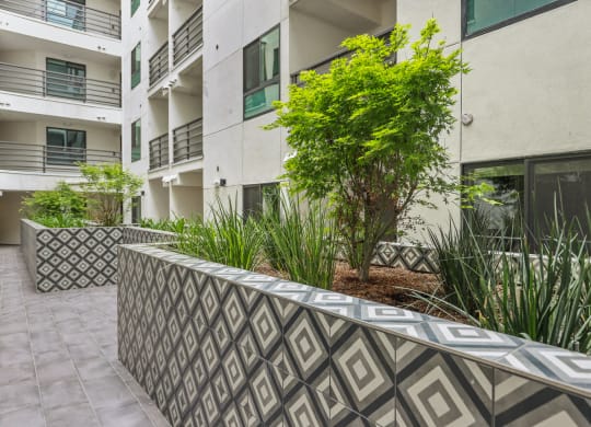 an image of the exterior of an apartment building at The Fairfax Flats Apartments, Los Angeles, CA