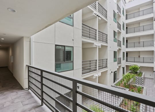 a view of the balconies of an apartment building at The Fairfax Flats Apartments, Los Angeles, CA, 90019