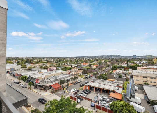 a view of the city from the top of a building at The Fairfax Flats Apartments, California, 90019