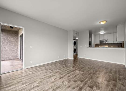 A room with a wooden floor and a speaker in it at Lafayette Apartments, Los Angeles 90019