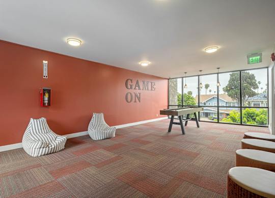 A room with a red wall and a sign at Lafayette Apartments, Los Angeles 90019