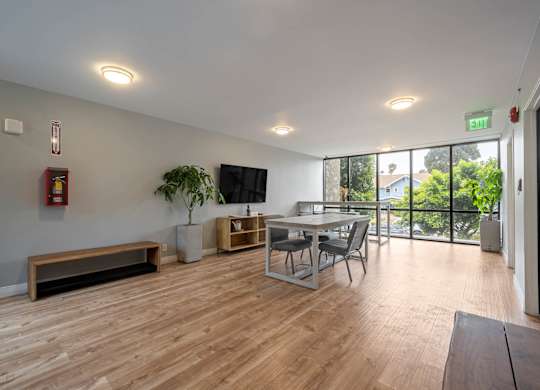 A room with wooden floors and a bench at Lafayette Apartments, Los Angeles, CA, 90019