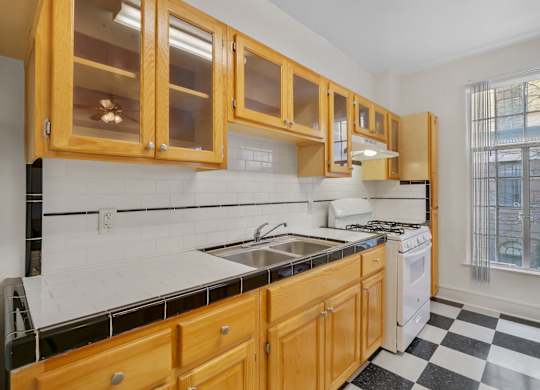 Kitchen with sink at The Langham Apartments, Los Angeles, CA