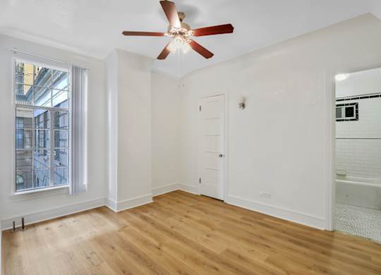Unfurnished bedroom with window at The Langham Apartments, Los Angeles