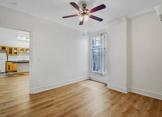 Unfurnished room with ceiling fan at The Langham Apartments, Los Angeles, 90005