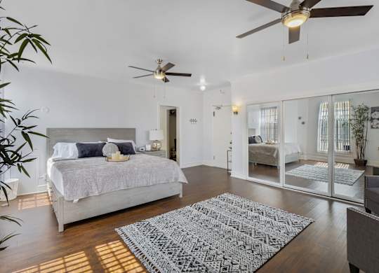 Living room with ceiling fan at The Langham Apartments, Los Angeles, CA, 90005