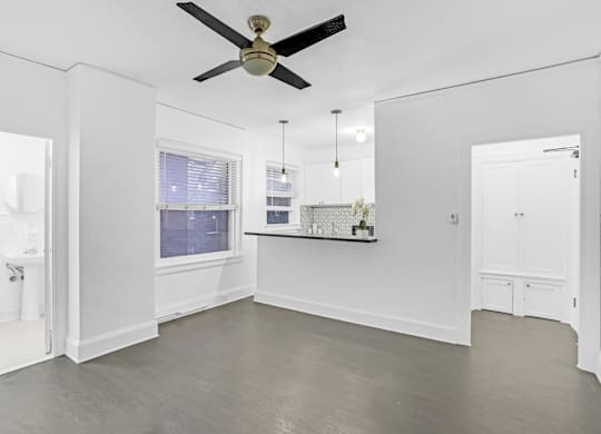 A spacious room with a ceiling fan and a window.at Park Wilshire, California, 90057
