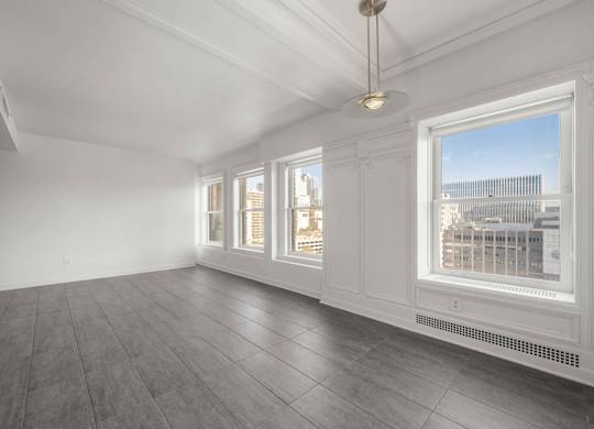 Room with Large windows at Grand Central Market Apartments, California, 90013