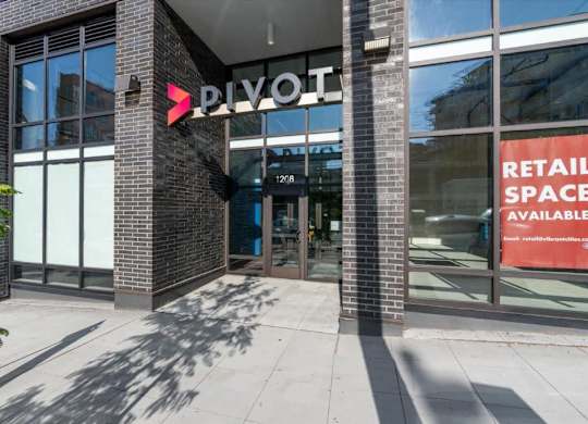 The front of a building with a sign that says
