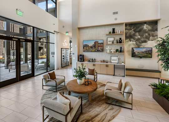 A modern living room with a glass door entrance.