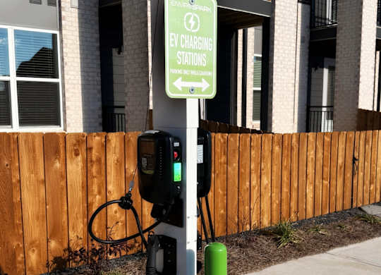 A bike rack is attached to a sign that says