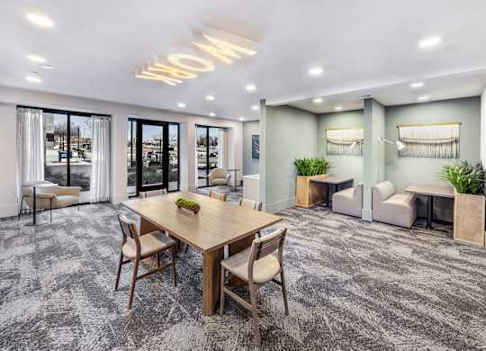 A conference room with a long table and chairs.