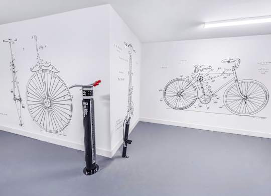 A bicycle is shown in a diagram on the wall.