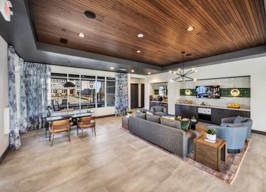 A modern living room with a grey sofa and wooden coffee table.