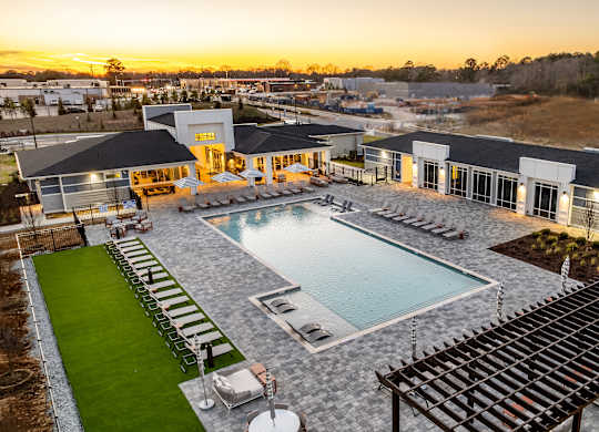 A large house with a pool in the backyard.