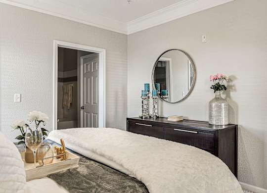 A bedroom with a large bed and a mirror above it at Echo at Lake Norman, Mooresville