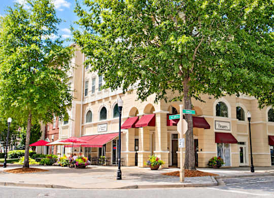 A building with a red awning and a sign that says