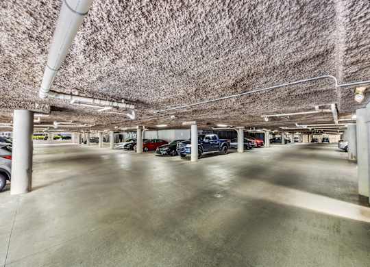 A parking garage with cars parked in it.