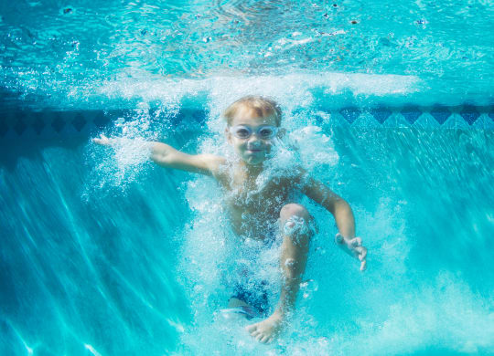 little boy swimming