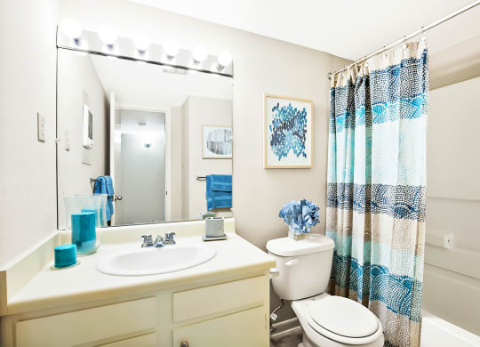 bathroom with shower and bathtub