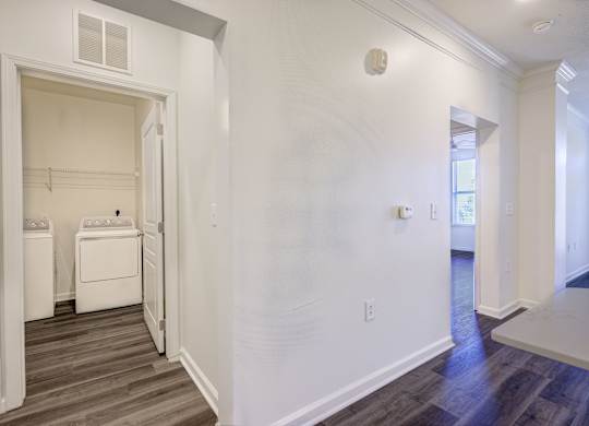 A laundry room with a washer and dryer in it.