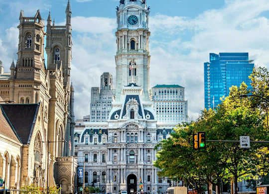A large, ornate building with a clock tower dominates the skyline.