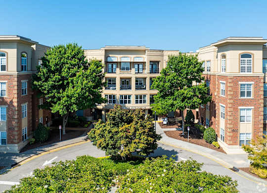 A large building with a tree in front of it.