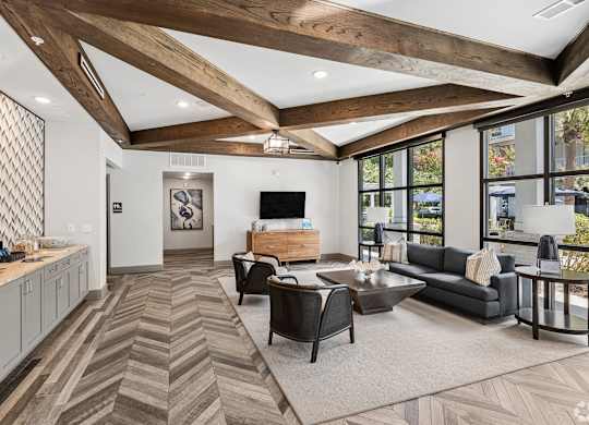 A modern living room with a wooden floor and ceiling.