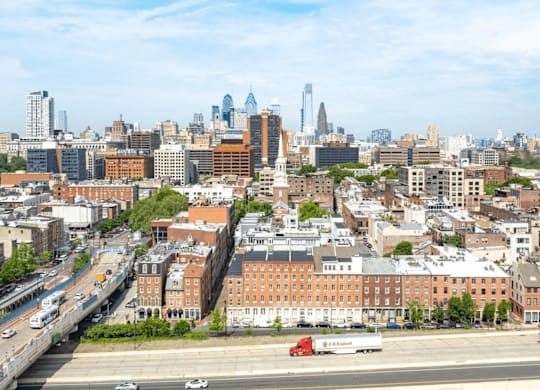 A cityscape with a highway and buildings.