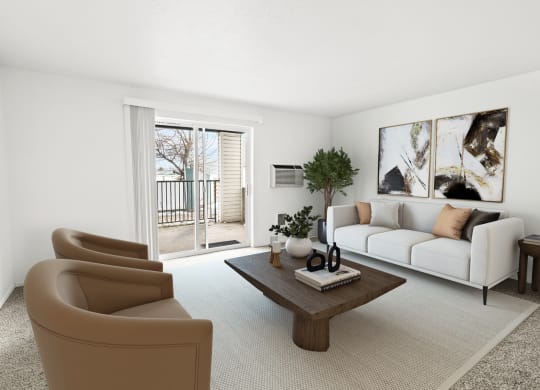 A bright living room with white walls and two glass sliding doors to a private balcony. Staged with a couch, 2 chairs, table and plant.at North Pointe, Post Falls, 83854