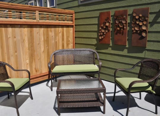 a patio with chairs and a table on a patio at Copper Pines, Bozeman, MT, 59718