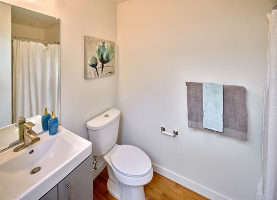 a bathroom with a toilet and a sink at Enve, Seattle Washington