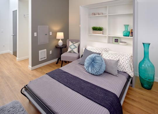 a bedroom with a bed and a blue vase at Enve, Washington, 98102