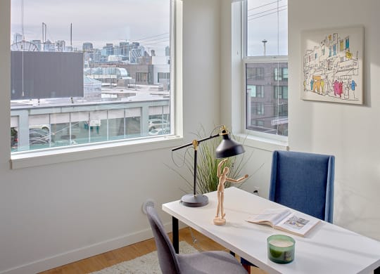 an office with a desk and a window with a view of the city at Enve, Seattle, WA