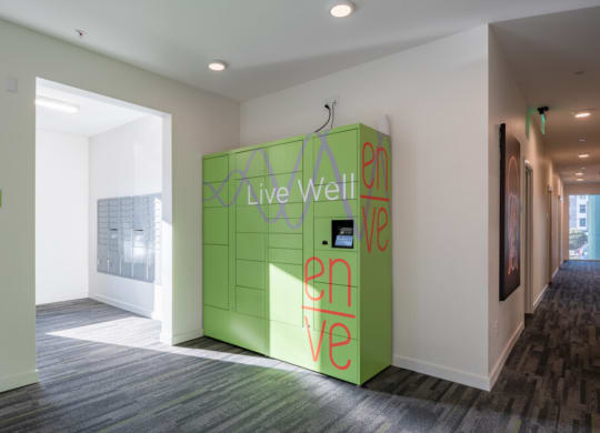 a green wall with live well written on it in a room at Enve, Seattle