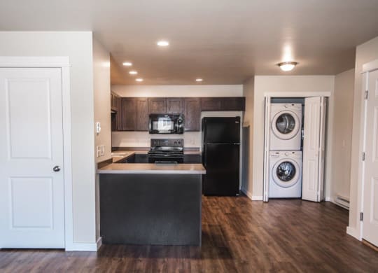 a kitchen with a washer and a dryer in it at Madison Park, Montana, 59718