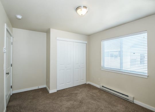 a room with carpet and a window and a door at Madison Park, Bozeman, MT, 59718