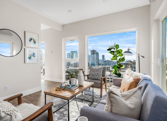 an open living room with a view of the city  at Oslo, Seattle, WA