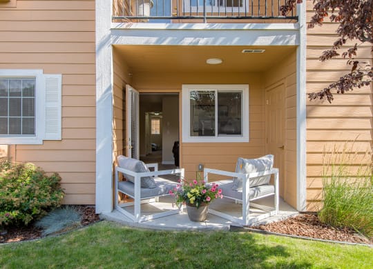 two rocking chairs on a porch of a home  at Quail Springs, West Richland, Washington