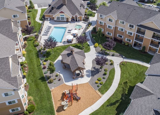an aerial view of a neighborhood with houses and a swimming pool  at Quail Springs, West Richland, WA