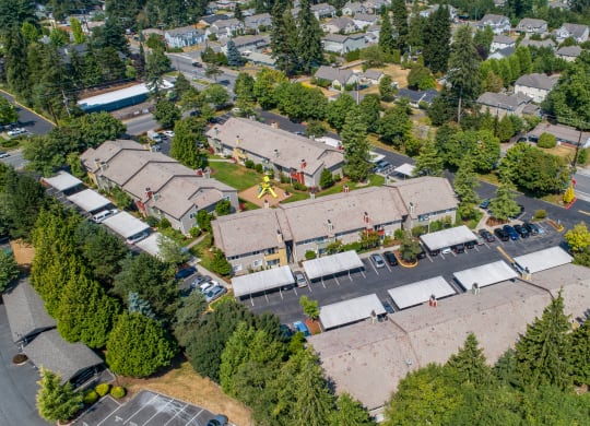 an aerial view of a neighborhood with houses and trees at Quartz Creek, Washington, 98043