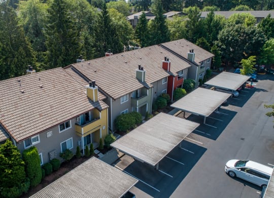 an aerial view of a building with a parking lot and trees at Quartz Creek, Washington