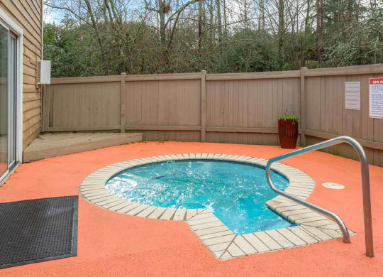 a small pool in the backyard of a house with a fence at Quartz Creek, Washington, 98043